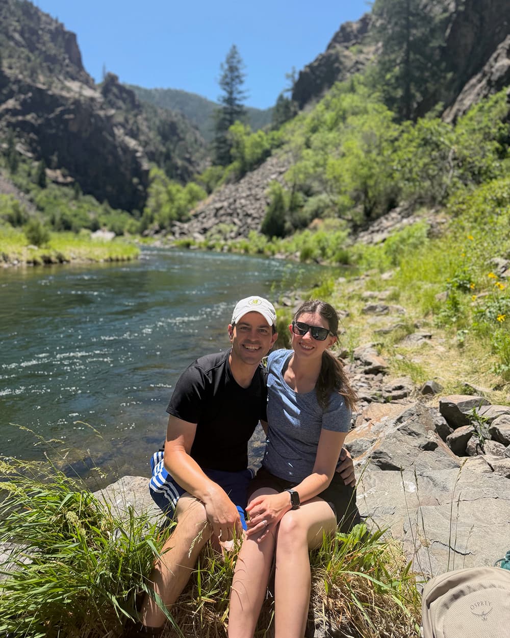 Jason and his wife Susan beside a mountain river